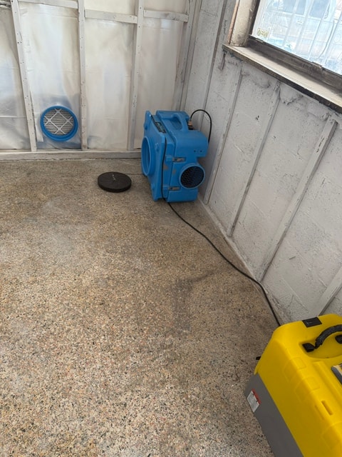 Air mover and dehumidifier in remediated space