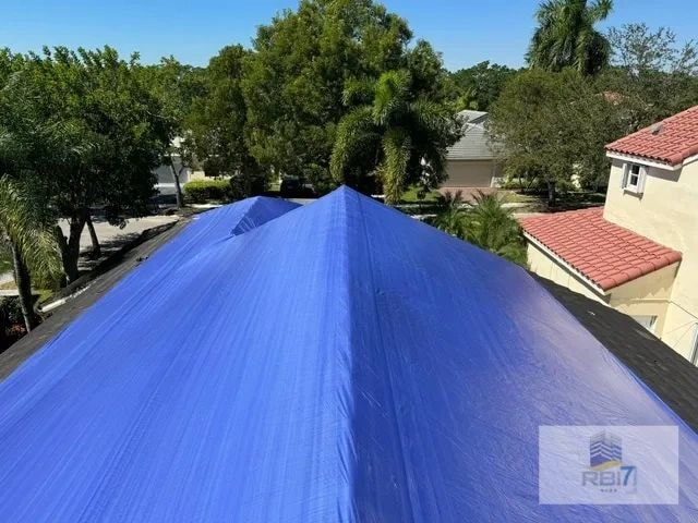 Storm damage and roof tarping process